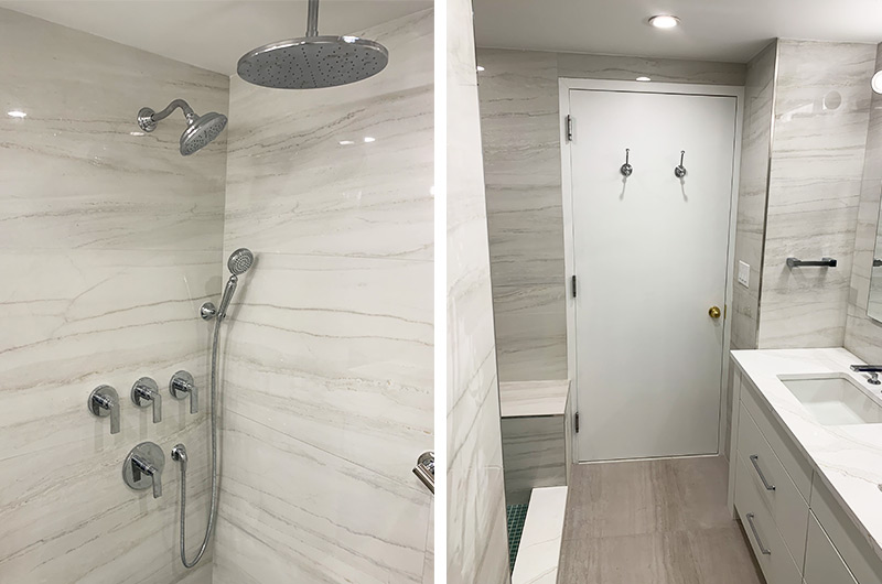 Light gray marble wall tiles with natural veining in a modern bathroom